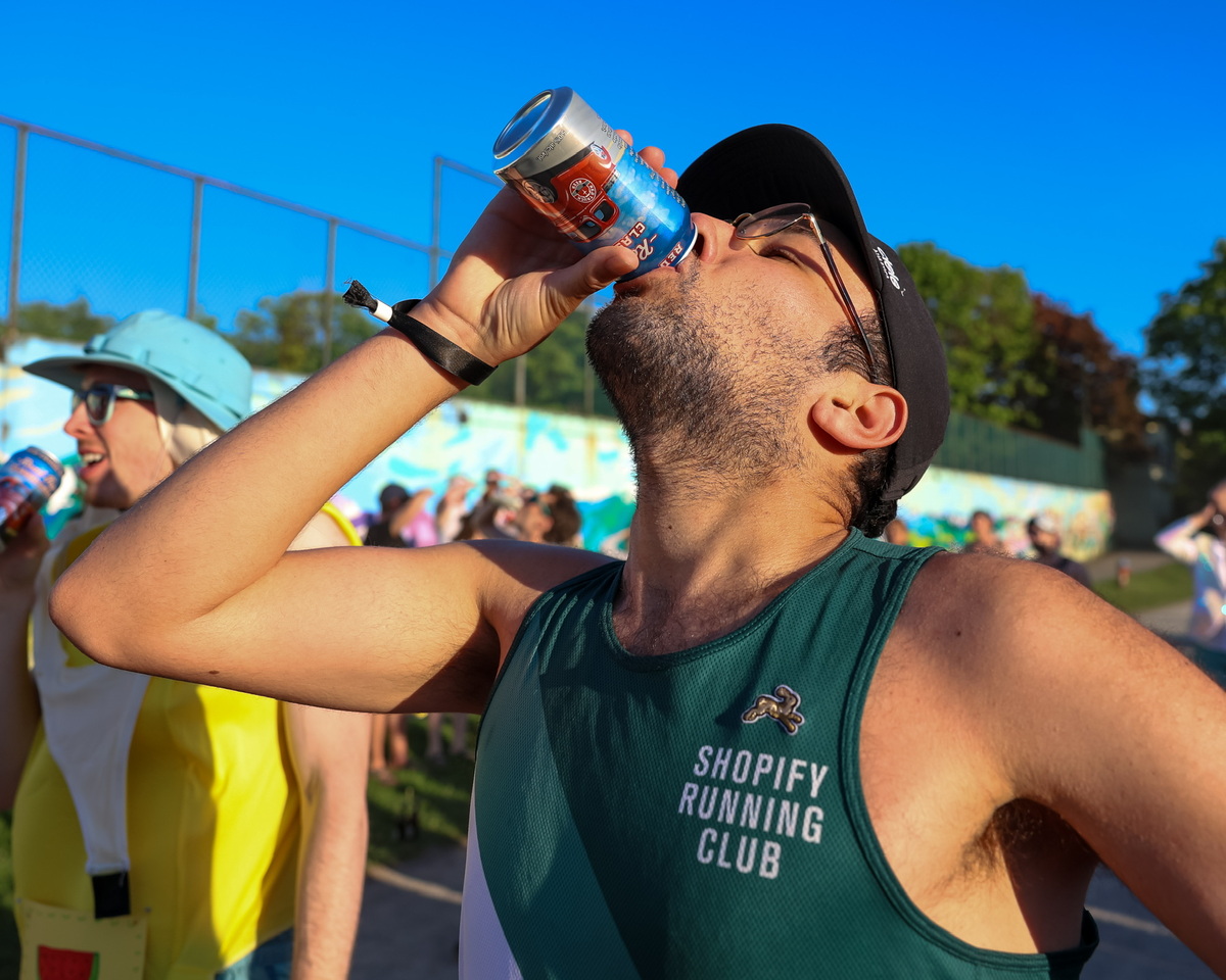 Me during the 2024 Vancouver Beer Mile, drinking a beer