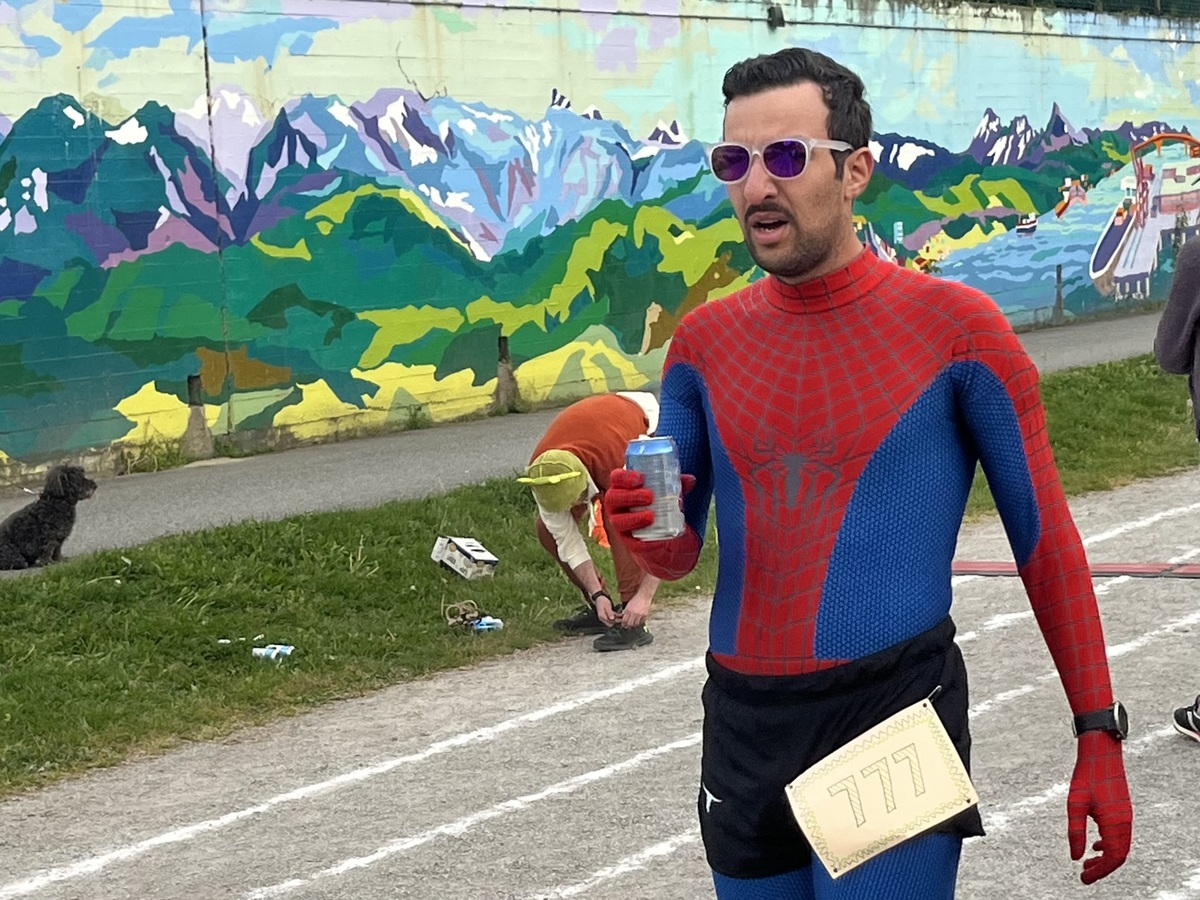 Me, dressed as Spider-Man, during the 2025 Vancouver Beer Mile, holding a beer and wearing bib 777